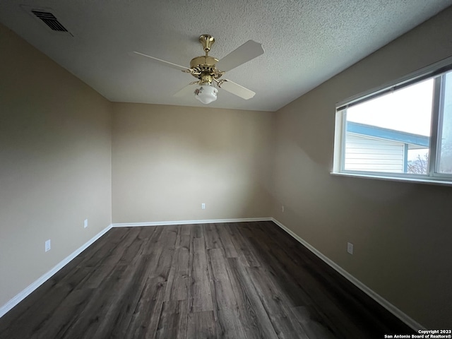 119 Cedar Tree Ln, Canyon Lake, TX 78133 - unfurnished room with ceiling fan, a textured ceiling, and dark hardwood / wood-style flooring