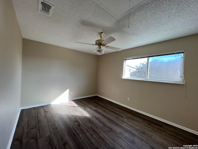 119 Cedar Tree Ln, Canyon Lake, TX 78133 - unfurnished room featuring dark wood-type flooring, a textured ceiling, and ceiling fan