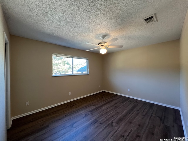 119 Cedar Tree Ln, Canyon Lake, TX 78133 - unfurnished room featuring a textured ceiling, ceiling fan, and dark wood-type flooring