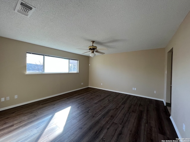 119 Cedar Tree Ln, Canyon Lake, TX 78133 - unfurnished room featuring dark hardwood / wood-style flooring, ceiling fan, and a textured ceiling