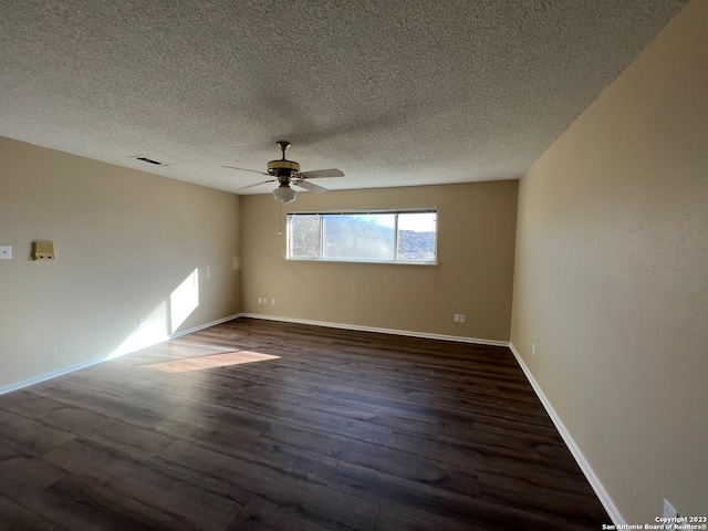 119 Cedar Tree Ln, Canyon Lake, TX 78133 - unfurnished room with ceiling fan, a textured ceiling, and dark wood-type flooring