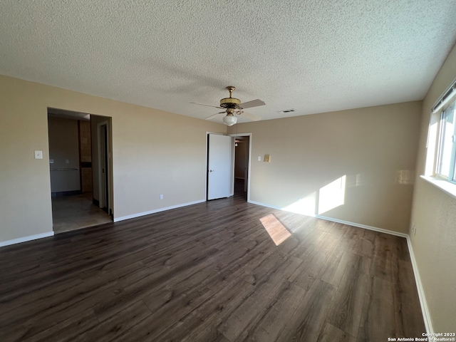 119 Cedar Tree Ln, Canyon Lake, TX 78133 - spare room featuring a textured ceiling, ceiling fan, and dark hardwood / wood-style flooring