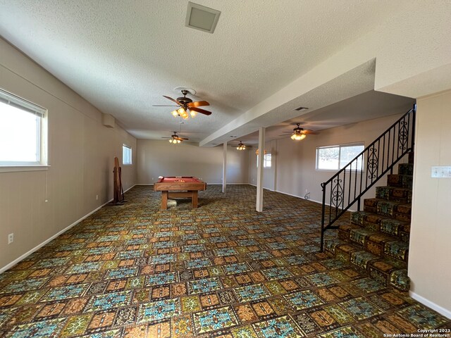 119 Cedar Tree Ln, Canyon Lake, TX 78133 - interior space featuring ceiling fan, billiards, plenty of natural light, and a textured ceiling