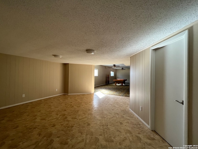 119 Cedar Tree Ln, Canyon Lake, TX 78133 - tiled spare room with ceiling fan and a textured ceiling