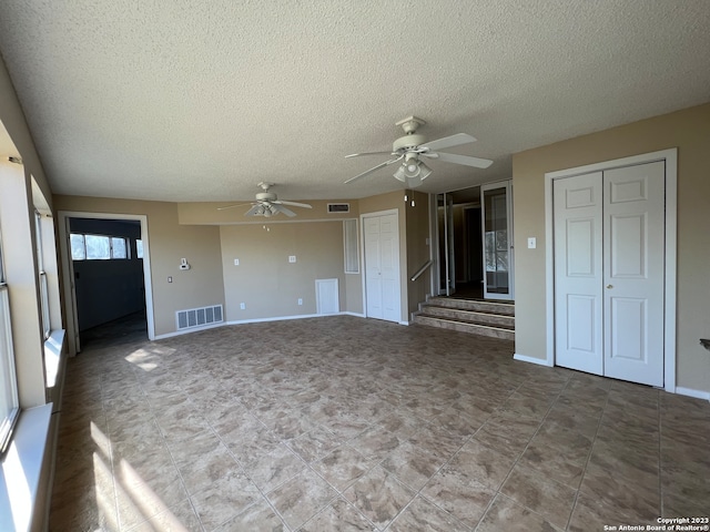 119 Cedar Tree Ln, Canyon Lake, TX 78133 - empty room featuring a textured ceiling, tile floors, and ceiling fan