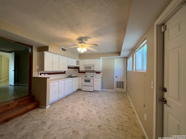 119 Cedar Tree Ln, Canyon Lake, TX 78133 - kitchen with light tile floors, ceiling fan, white appliances, white cabinets, and sink