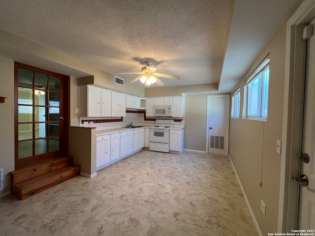 119 Cedar Tree Ln, Canyon Lake, TX 78133 - kitchen featuring white appliances, white cabinetry, ceiling fan, and light tile flooring