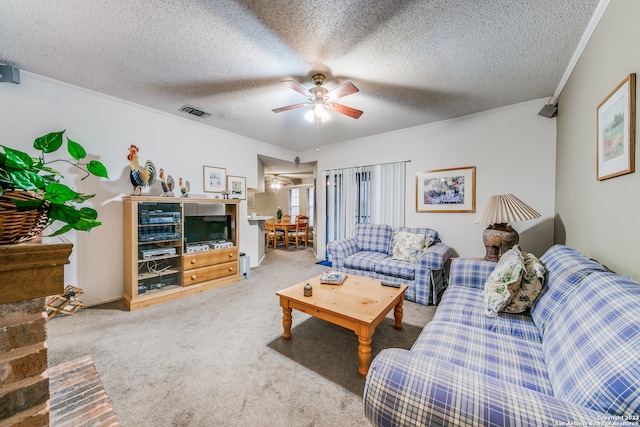 carpeted living room with ceiling fan and a textured ceiling