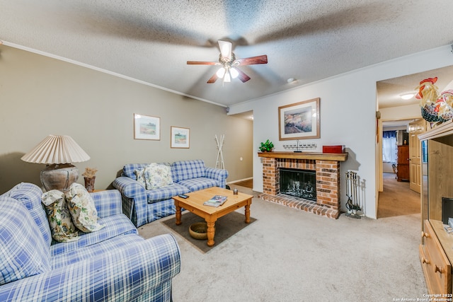 living room with ceiling fan, light colored carpet, a brick fireplace, and a textured ceiling