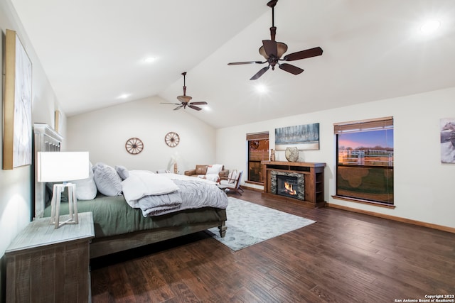 bedroom with ceiling fan, dark wood-type flooring, and lofted ceiling