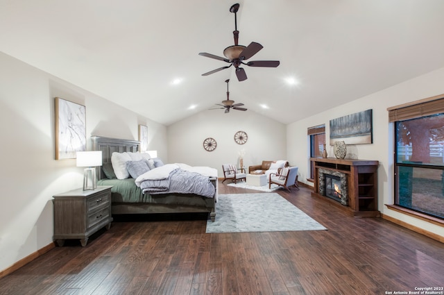 bedroom with ceiling fan, dark wood-type flooring, and lofted ceiling