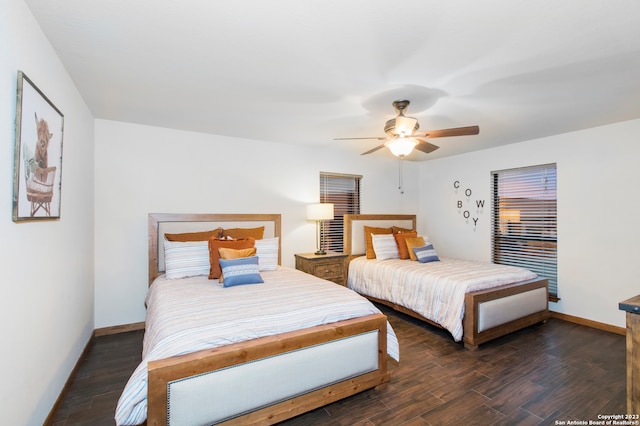 bedroom featuring ceiling fan and dark hardwood / wood-style flooring