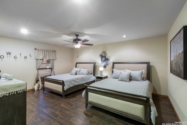 bedroom featuring ceiling fan and dark hardwood / wood-style flooring