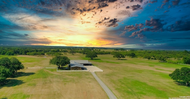 aerial view at dusk featuring a rural view