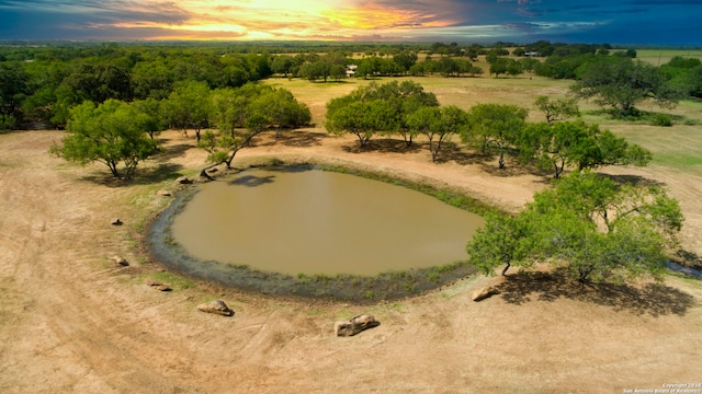 aerial view at dusk featuring a rural view