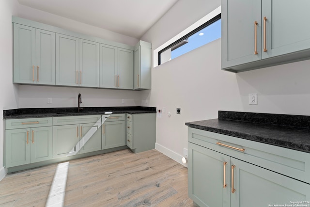 kitchen with light wood-type flooring and sink