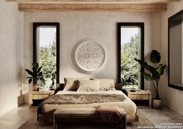 bedroom with beam ceiling and multiple windows