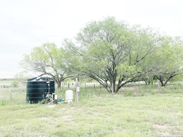 view of yard with a rural view