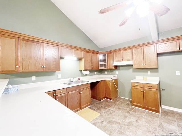 kitchen featuring ceiling fan, sink, light tile floors, and high vaulted ceiling