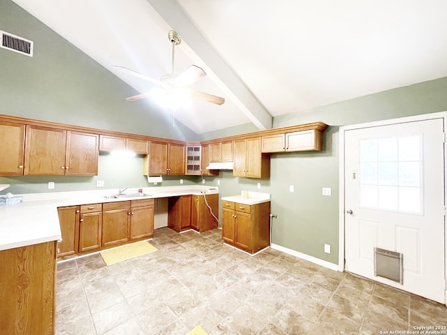 kitchen with ceiling fan, sink, beam ceiling, and light tile flooring