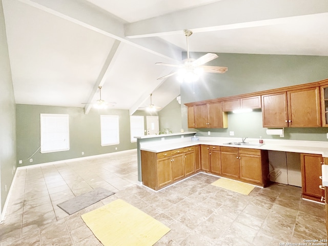 kitchen with sink, beam ceiling, ceiling fan, and light tile flooring