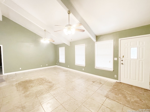 tiled foyer entrance featuring ceiling fan and lofted ceiling with beams