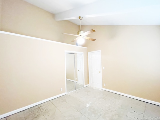 empty room featuring light tile floors, ceiling fan, high vaulted ceiling, and beam ceiling