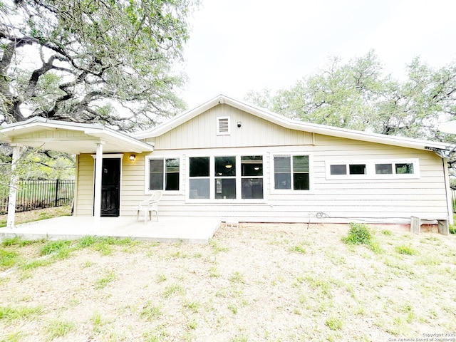 back of property with a patio area