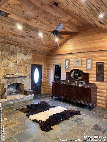 interior space with log walls, wooden ceiling, a stone fireplace, high vaulted ceiling, and tile floors