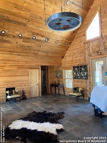 tiled bedroom featuring wooden ceiling, high vaulted ceiling, and multiple windows