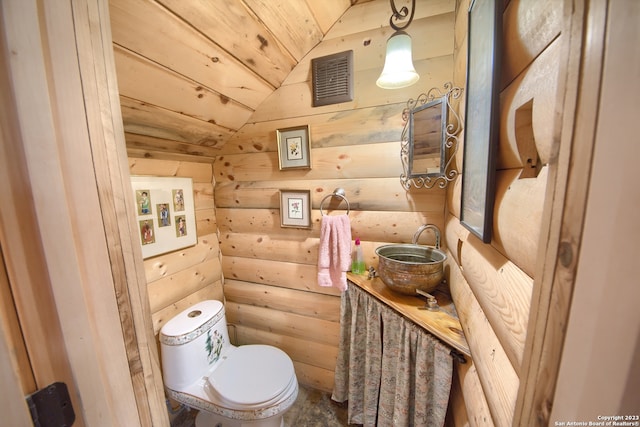 bathroom featuring lofted ceiling, toilet, and wood ceiling