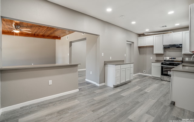 kitchen with light hardwood / wood-style floors, white cabinetry, stainless steel range oven, ceiling fan, and wood ceiling