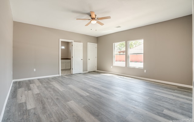 spare room featuring light hardwood / wood-style floors and ceiling fan