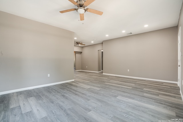 spare room with light hardwood / wood-style floors and ceiling fan