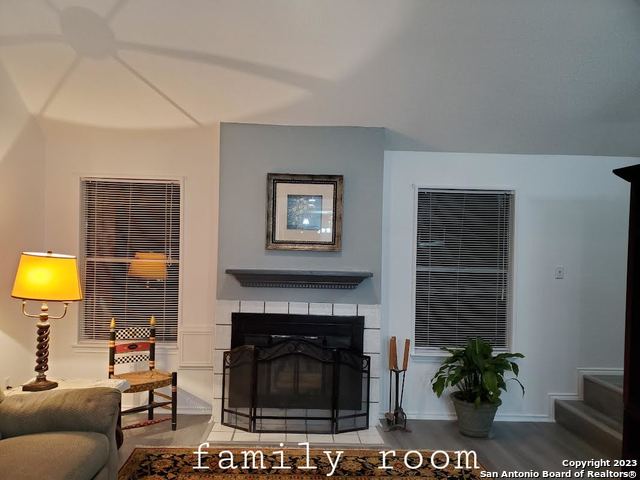 living room with light hardwood / wood-style flooring and a fireplace