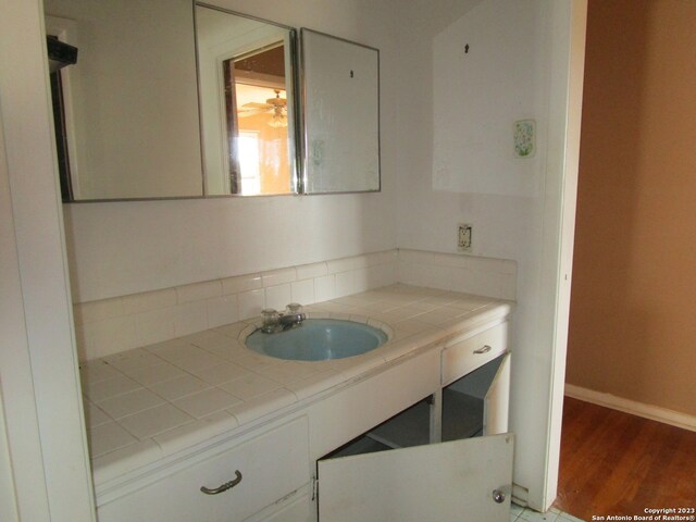 bathroom featuring vanity and wood-type flooring