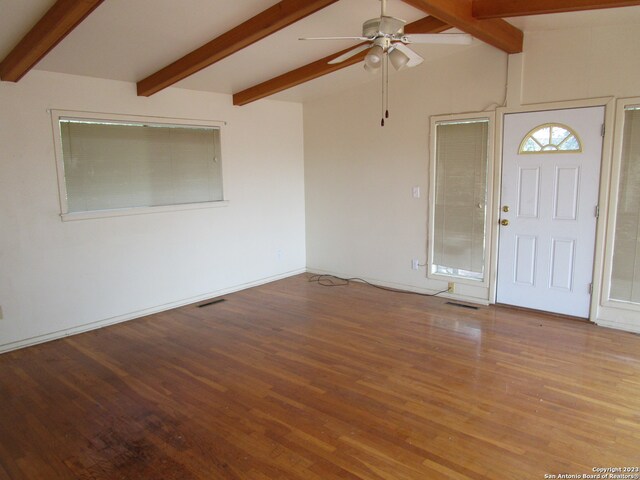 foyer featuring wood-type flooring, ceiling fan, and beamed ceiling