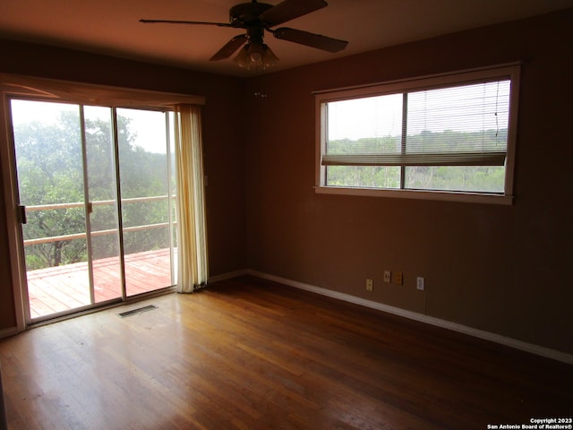 empty room with wood-type flooring and ceiling fan