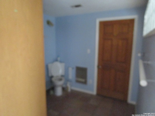 bathroom featuring toilet