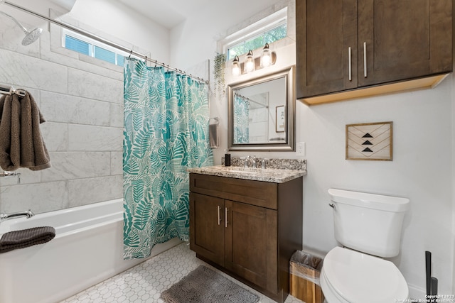 full bathroom with shower / tub combo with curtain, tile flooring, toilet, and vanity