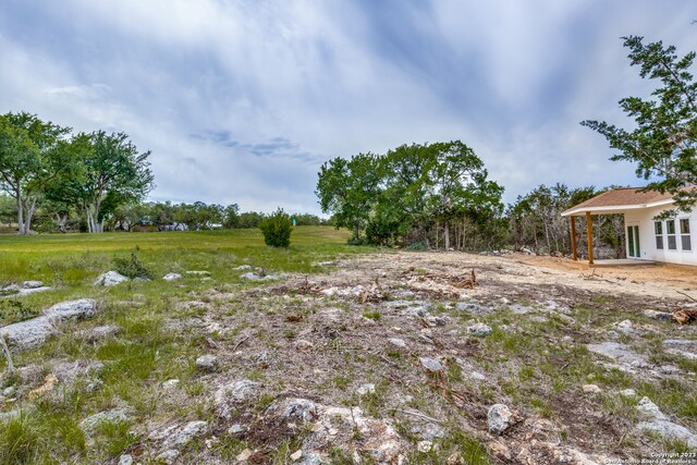 view of yard with a rural view