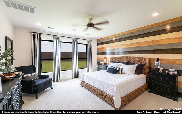 bedroom with light carpet and ceiling fan