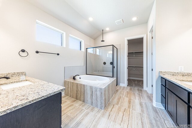 bathroom featuring vanity, plus walk in shower, tile floors, and lofted ceiling