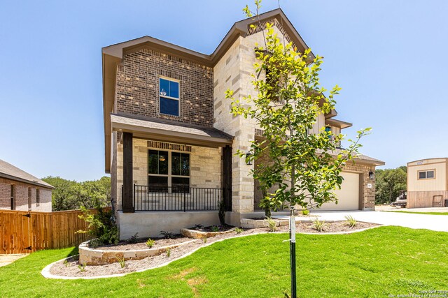 view of front facade featuring a front lawn and a garage