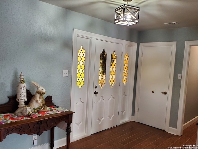 foyer featuring dark hardwood / wood-style floors