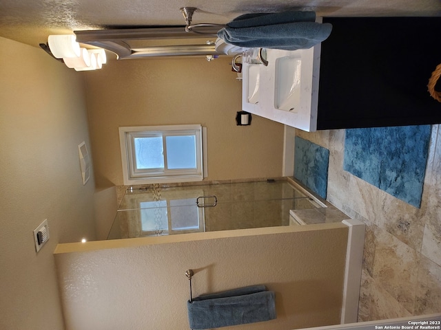 bathroom featuring a textured ceiling