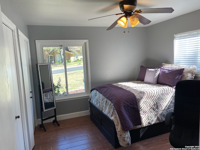 bedroom featuring ceiling fan and dark wood-type flooring