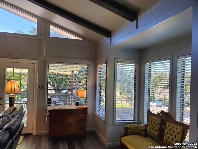 sunroom / solarium with lofted ceiling with beams and a wealth of natural light