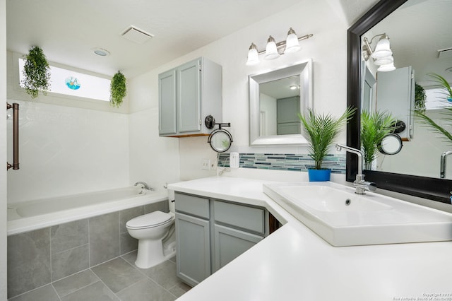 bathroom with vanity, tile flooring, and toilet