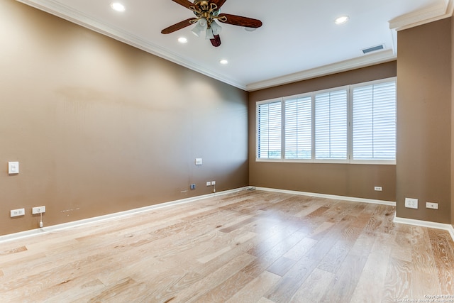 unfurnished room featuring ornamental molding, ceiling fan, and light wood-type flooring